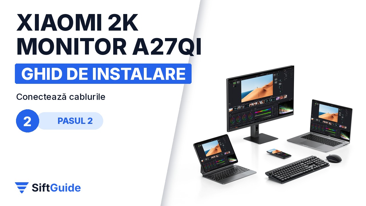 Monitorul Xiaomi A27Qi conectat la laptop, cu tastatură și mouse pe birou