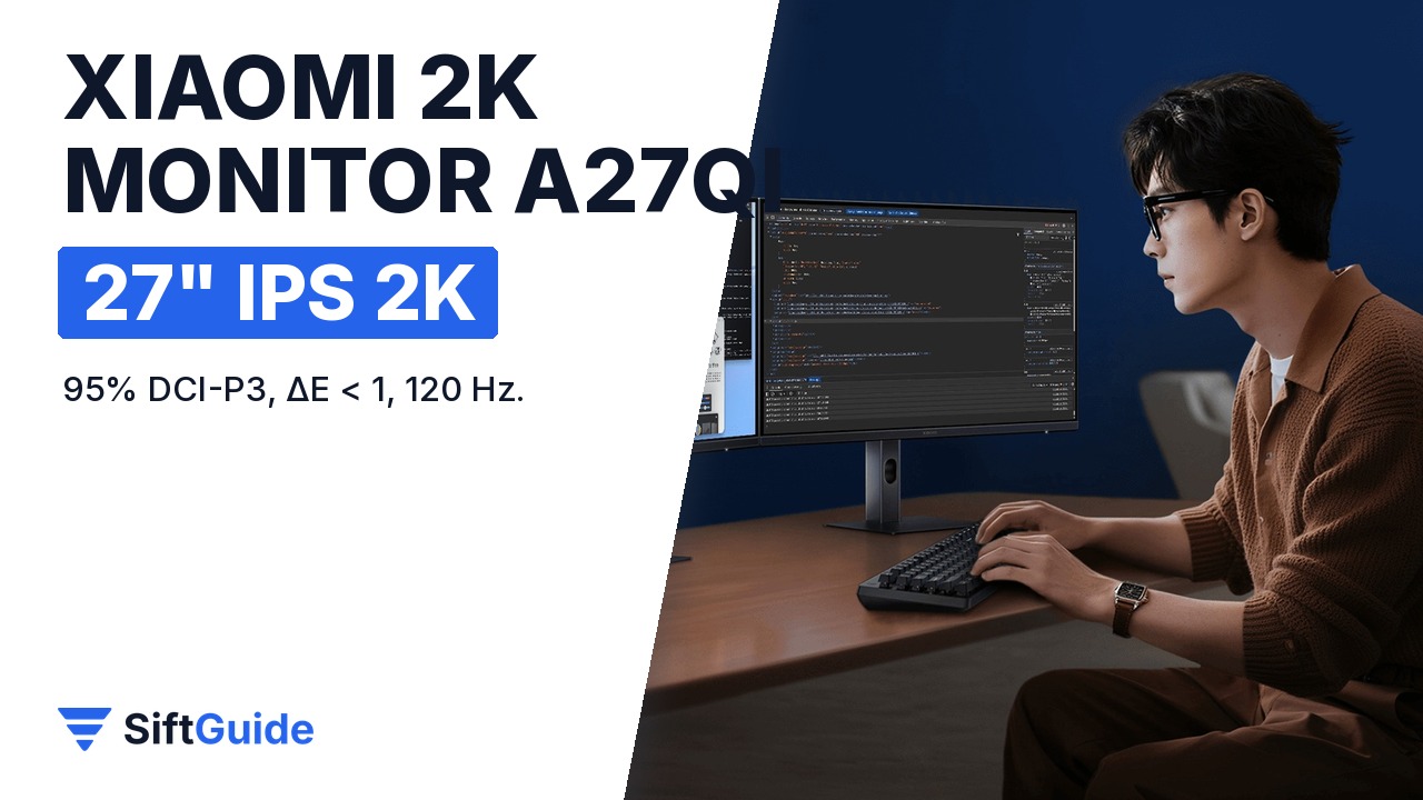 Om lucrând la birou pe monitorul Xiaomi 2K A27Qi